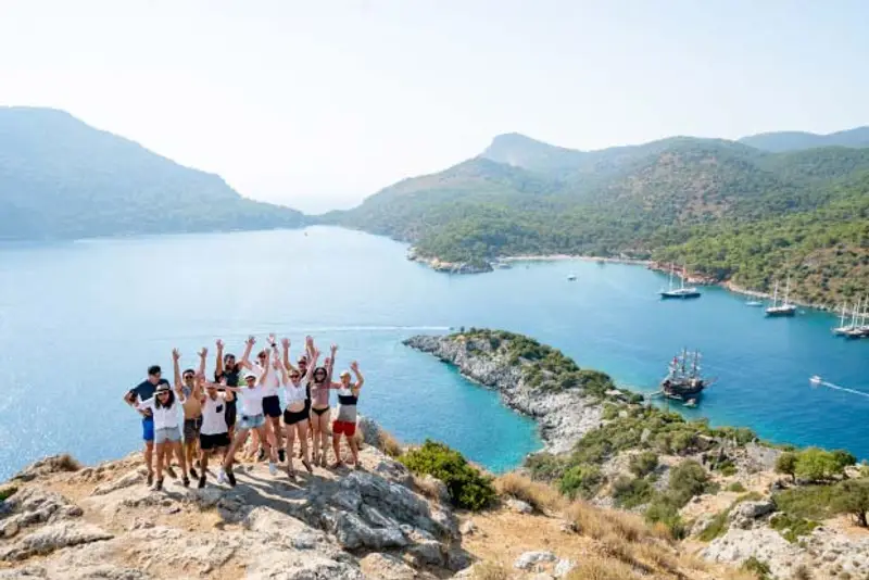 A group of young travellers on an island hopping sailing adventure in Turkey.