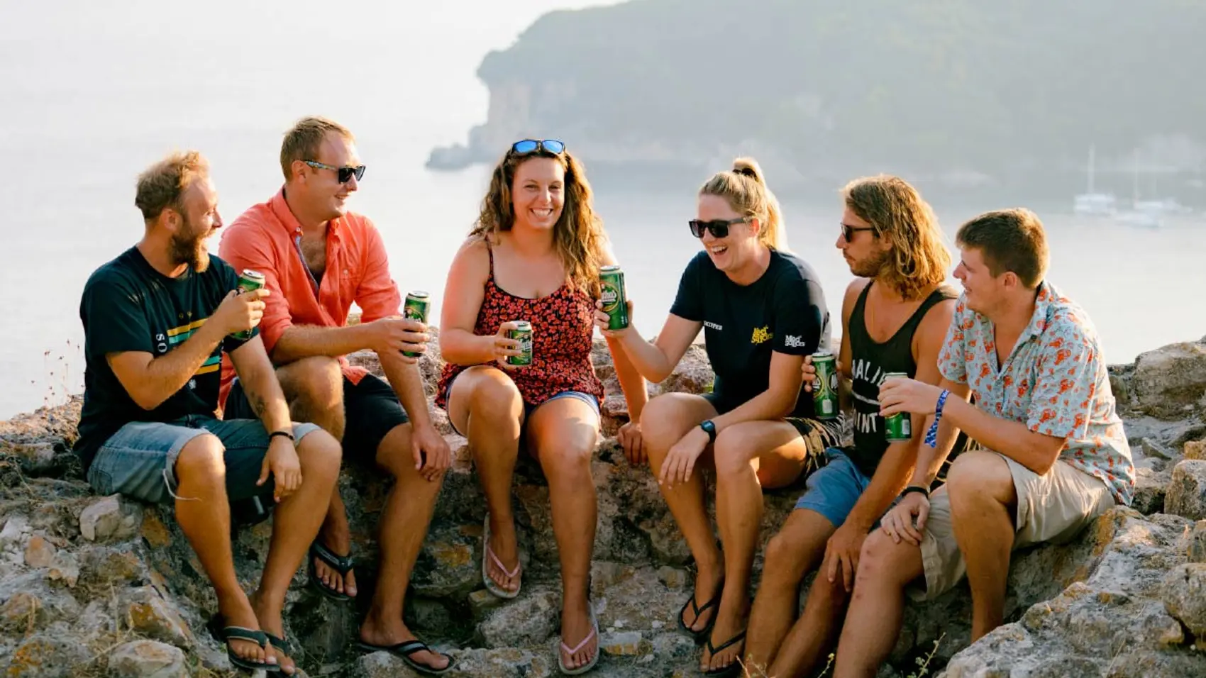 Group of friends having a beer together in Parga