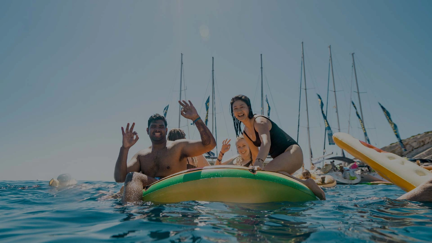 Group of friends on floaties in Croatia