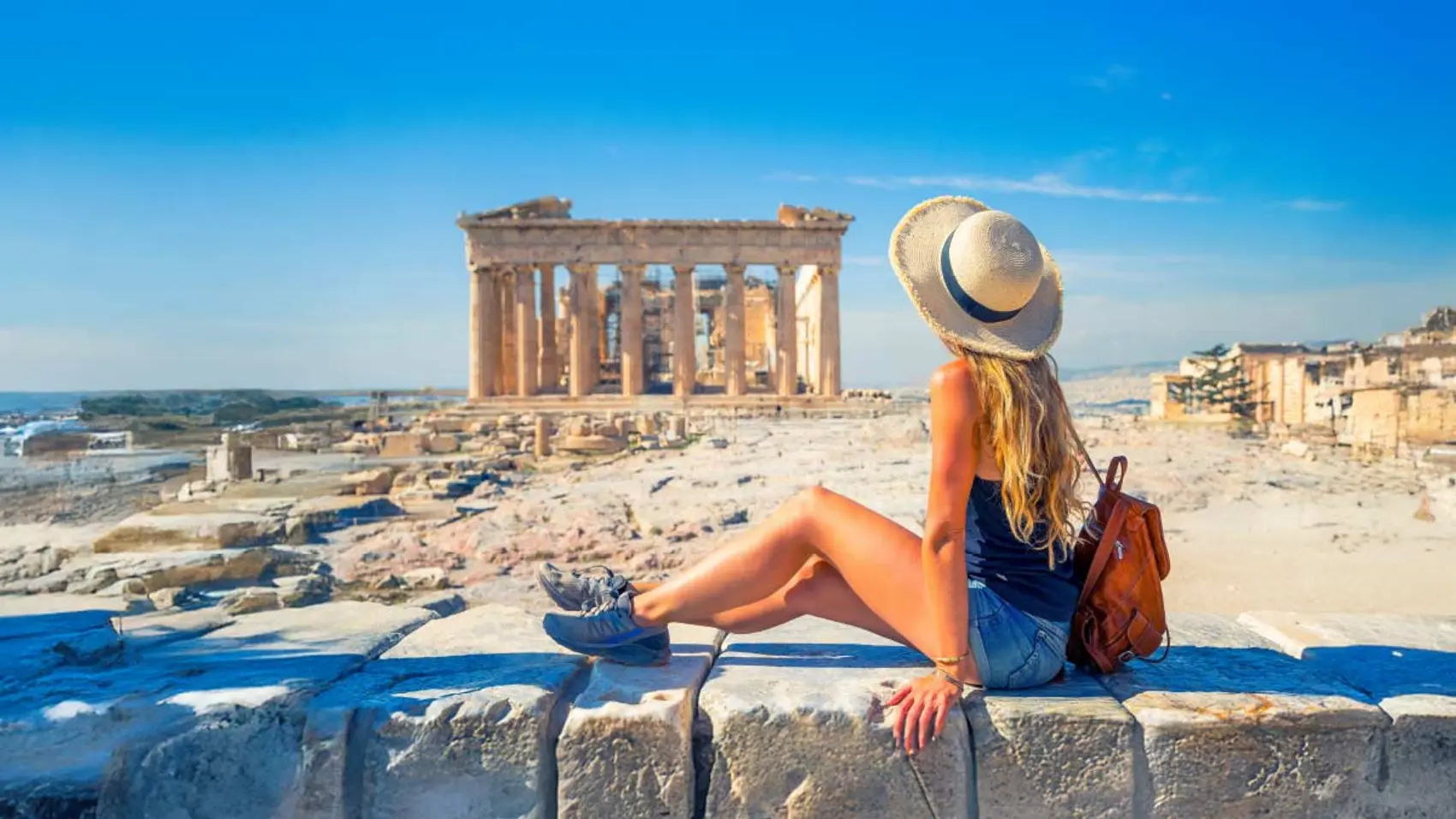 Woman posing for a photo at the Acropolis in Greece