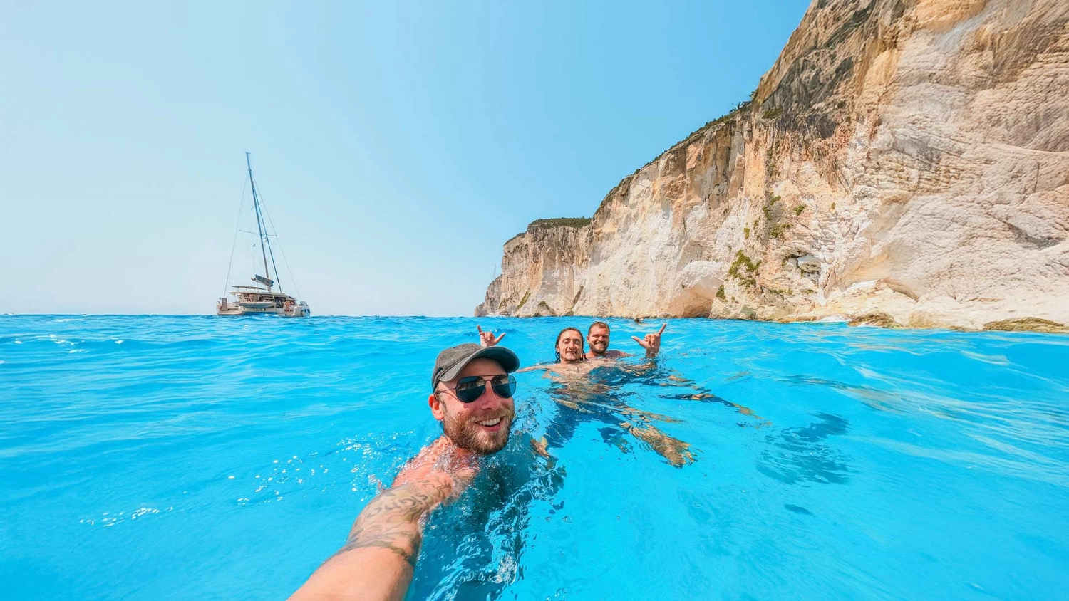 Three friends swimming near the Blue Caves in Corfu