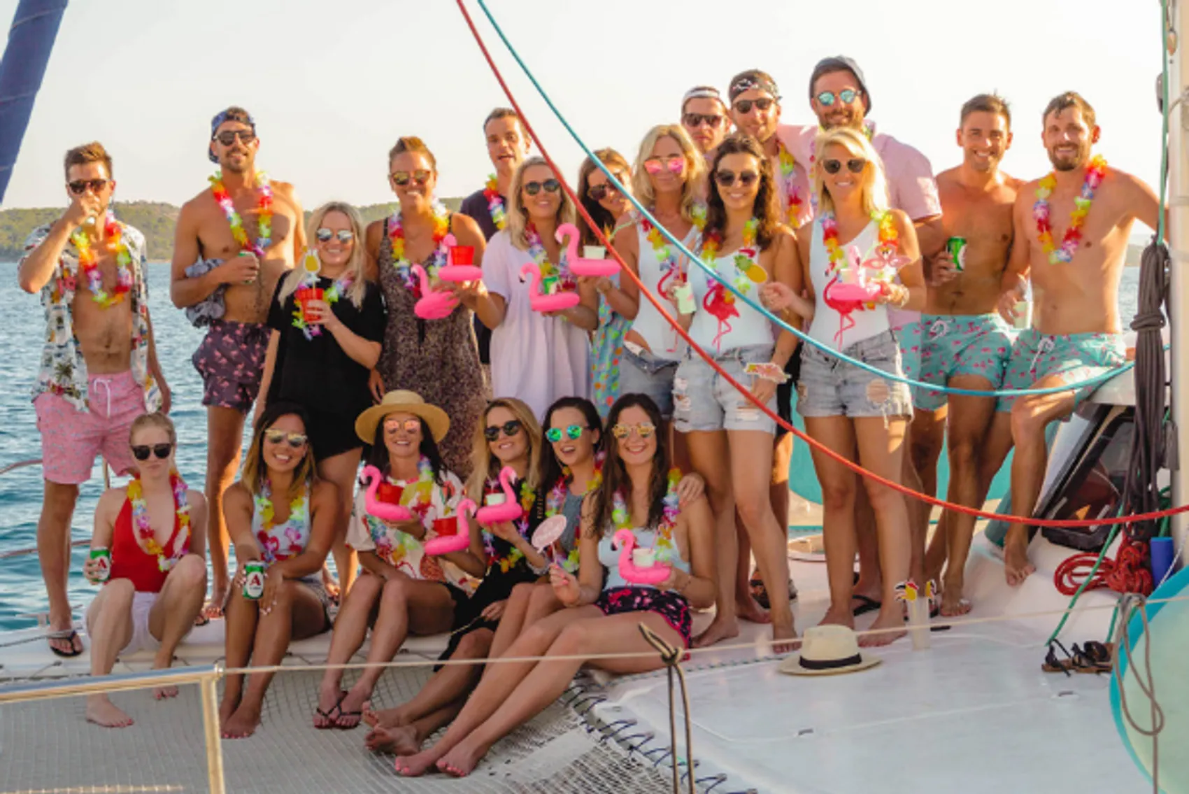 Group of people in fancy dress on a yacht.