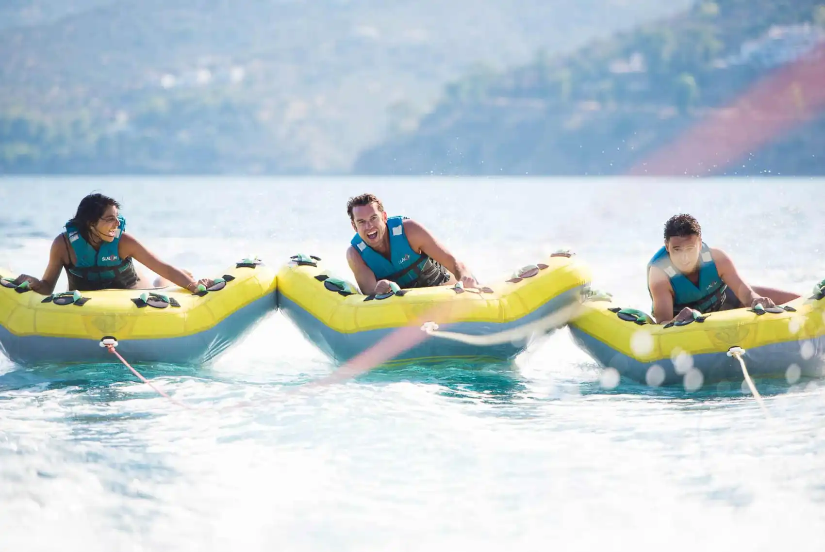 Group of friends doing watersports at Iggy Beach in Greece