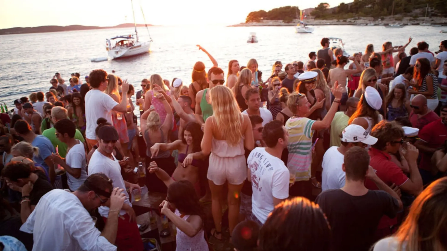 Group of young travellers partying seaside at a Croatian club Hula Hula, one of the best party destinations in Europe.