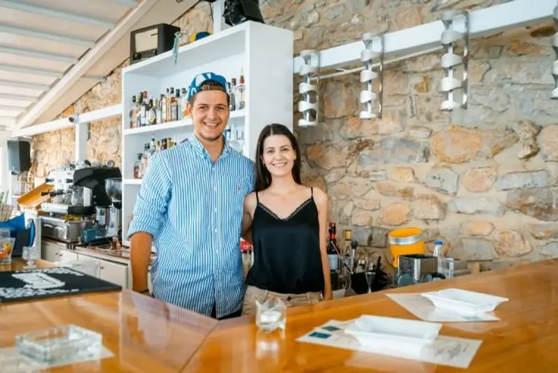Thanos and Maria at the bar in Greece