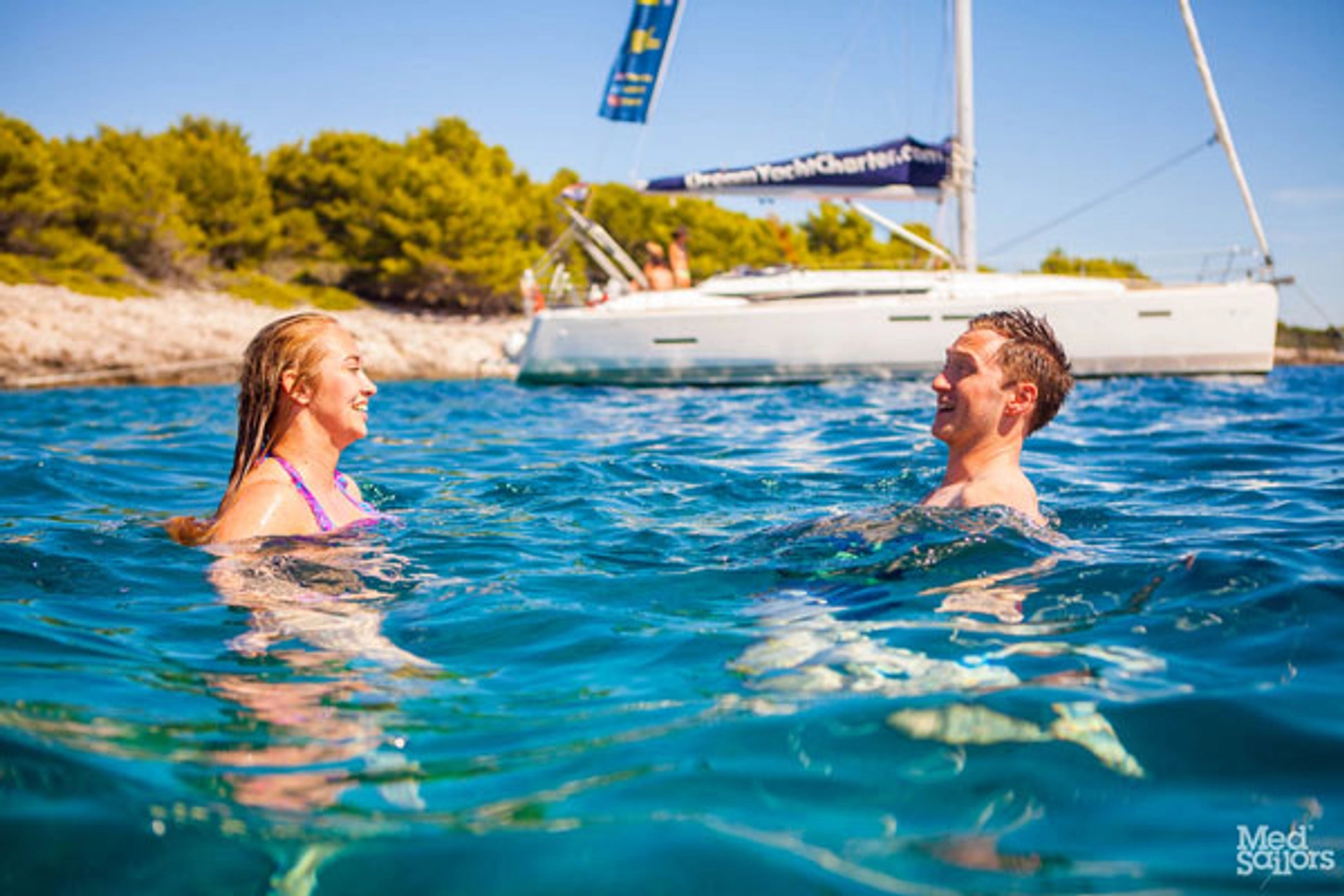 Couple swim in the ocean