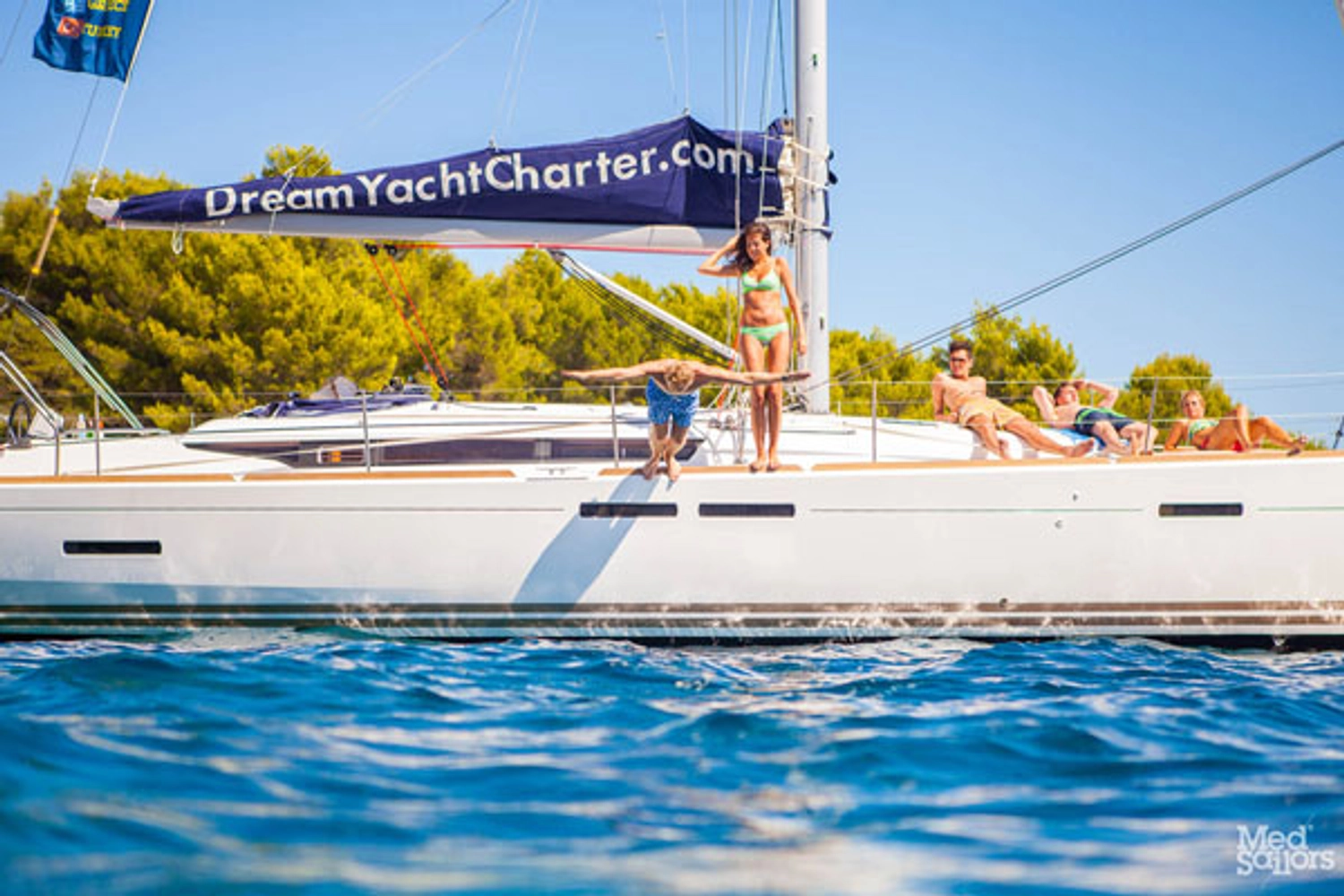 Man jumps off a yacht into the water