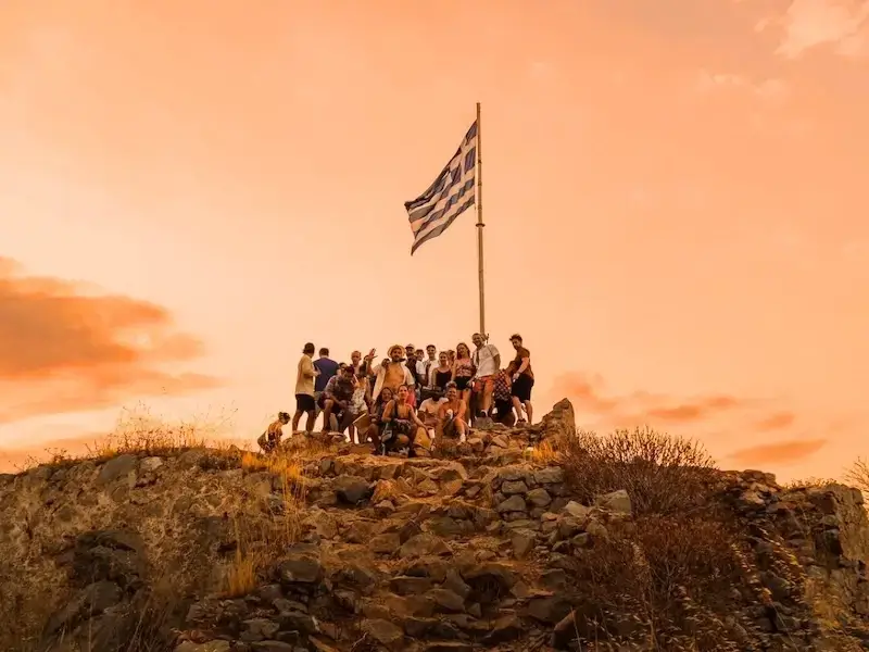 Greek sunset photo with a group of 20s and 30s travellers on a budget contiki Greek island hopping trip with MedSailors.