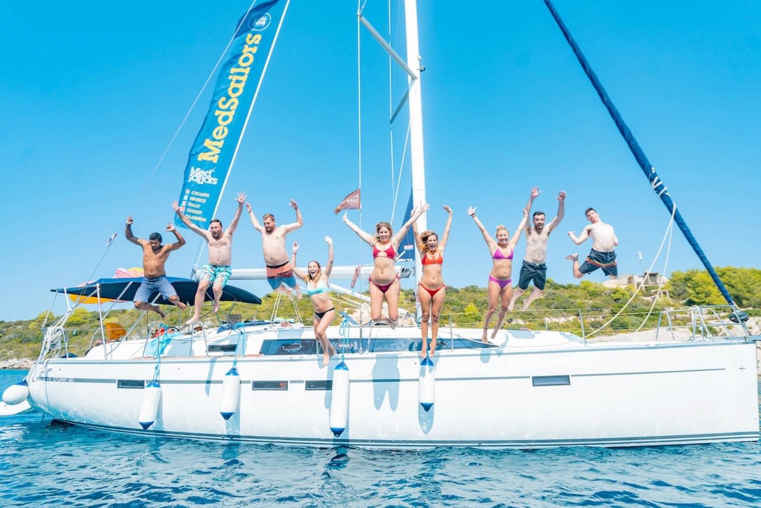 Kiwis in London on a sail week in Croatia with MedSailors jumping off the side of a yacht in a beautiful Mediterranean bay.