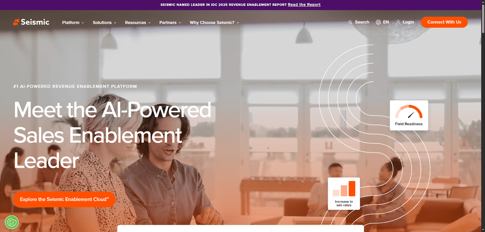 Two people discuss using insurance distribution software in a modern office.