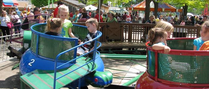 Kids riding the Turtles Kiddie Ride at DelGrosso's Amusement Park