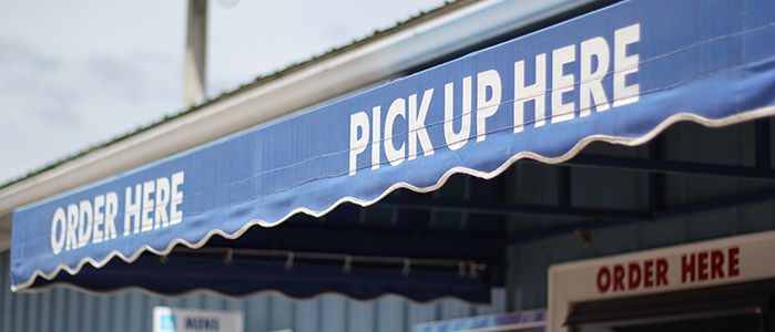 Order and Pick Up Here signs at Laguna Snacks concession stand