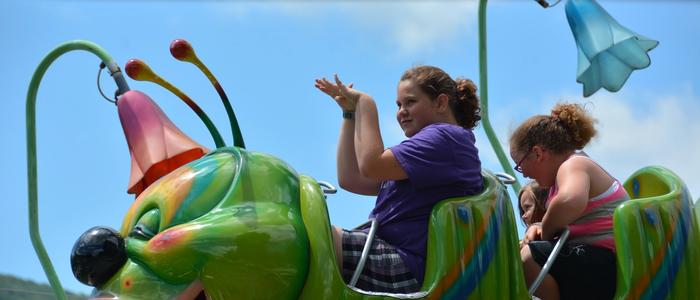 guest enjoying the Wacky Worm Family Ride at DelGrosso's Amusement Park