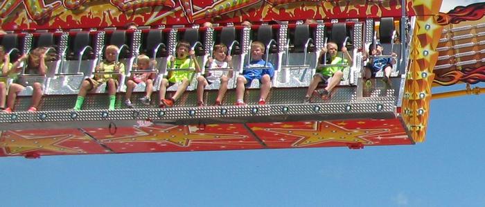Kids on the Rock Star ride at DelGrosso's Park.