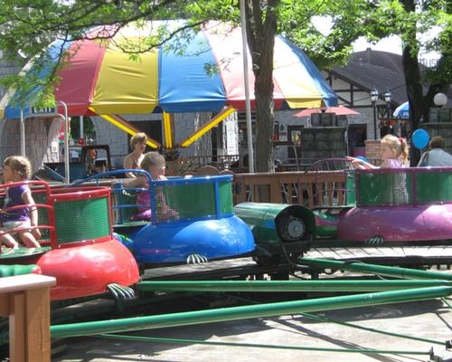 Kids riding the Turtles Kiddie Ride at DelGrosso's Amusement Park