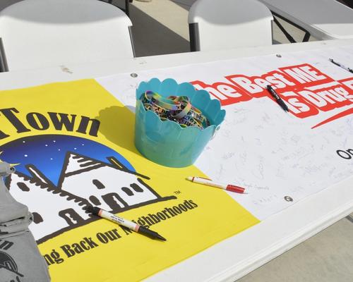 Image of Operation Our Town Shirts and Banner