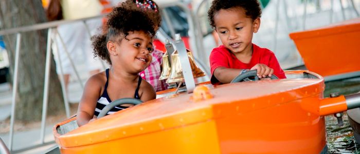 Kids enjoying the Boats Kiddie Ride at DelGrosso's Amusement Park
