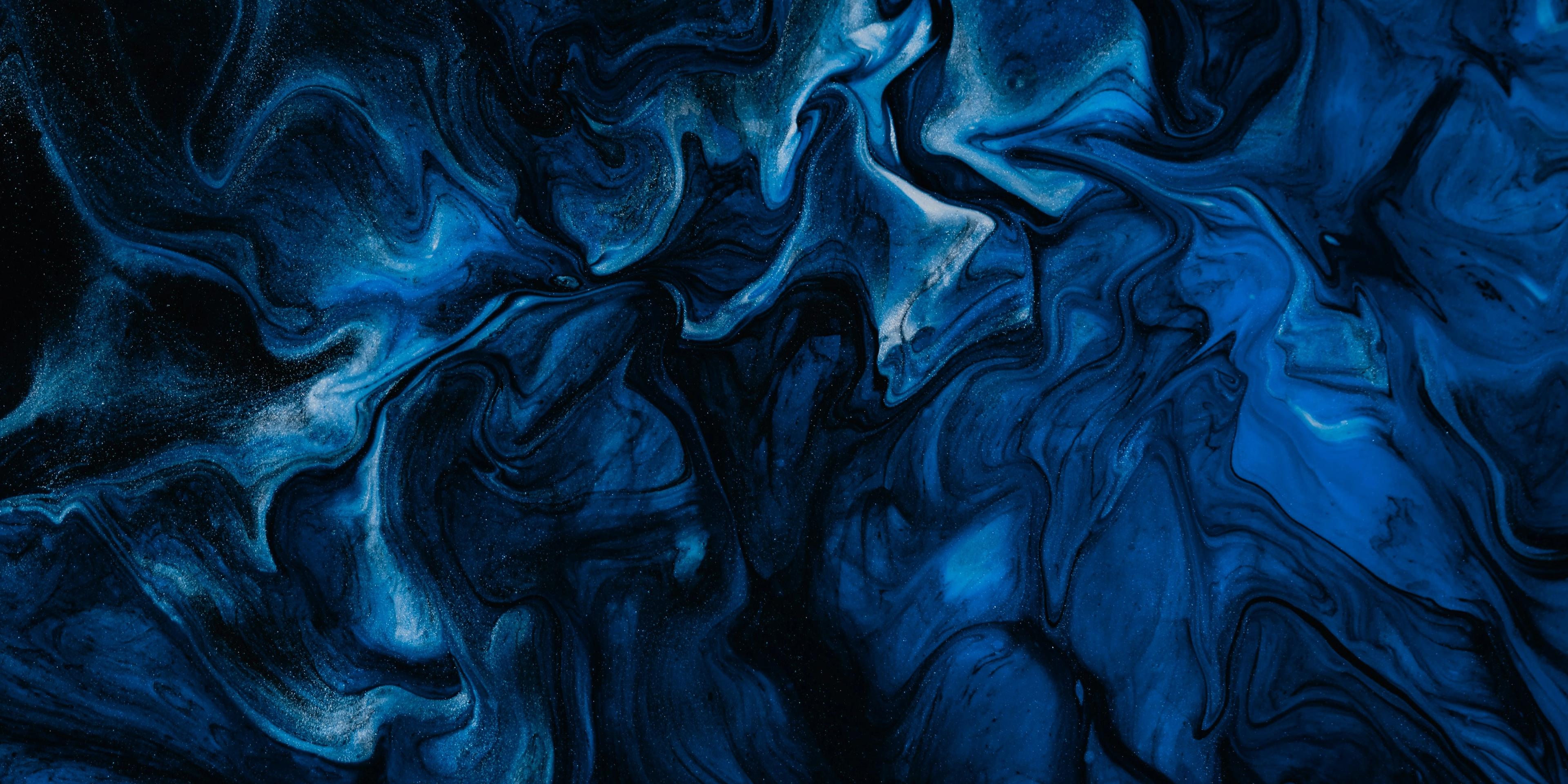 a close up of a blue marble texture on a black background .