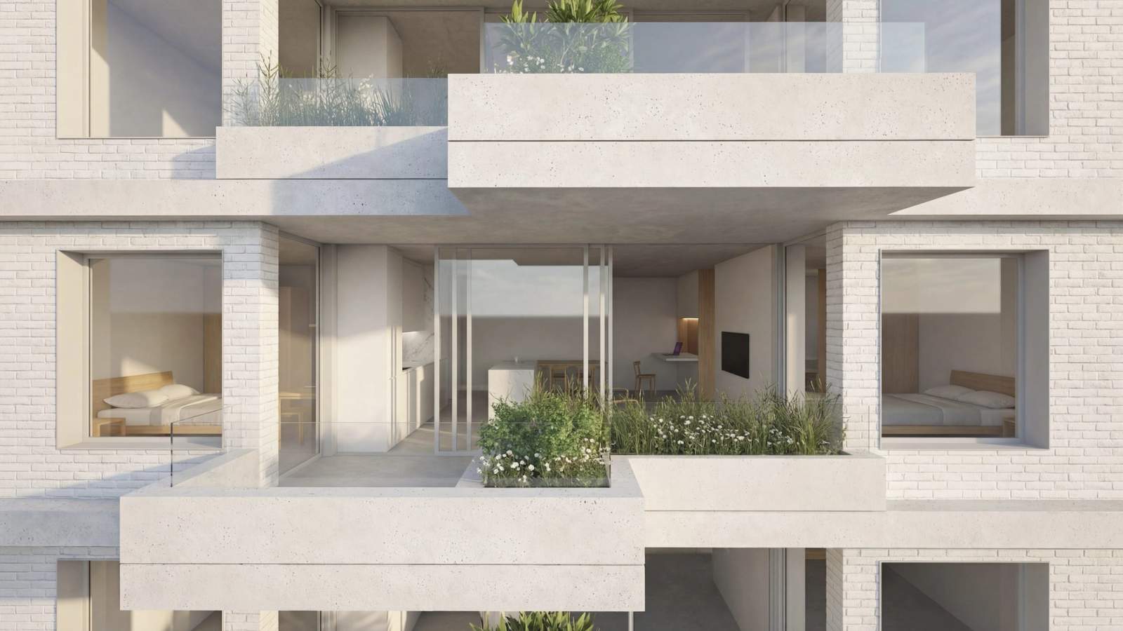 Habitação para arrendamento a custo acessível em Lordelo — pormenor da fachada: as varandas-jardim em betão e o tijolo branco.