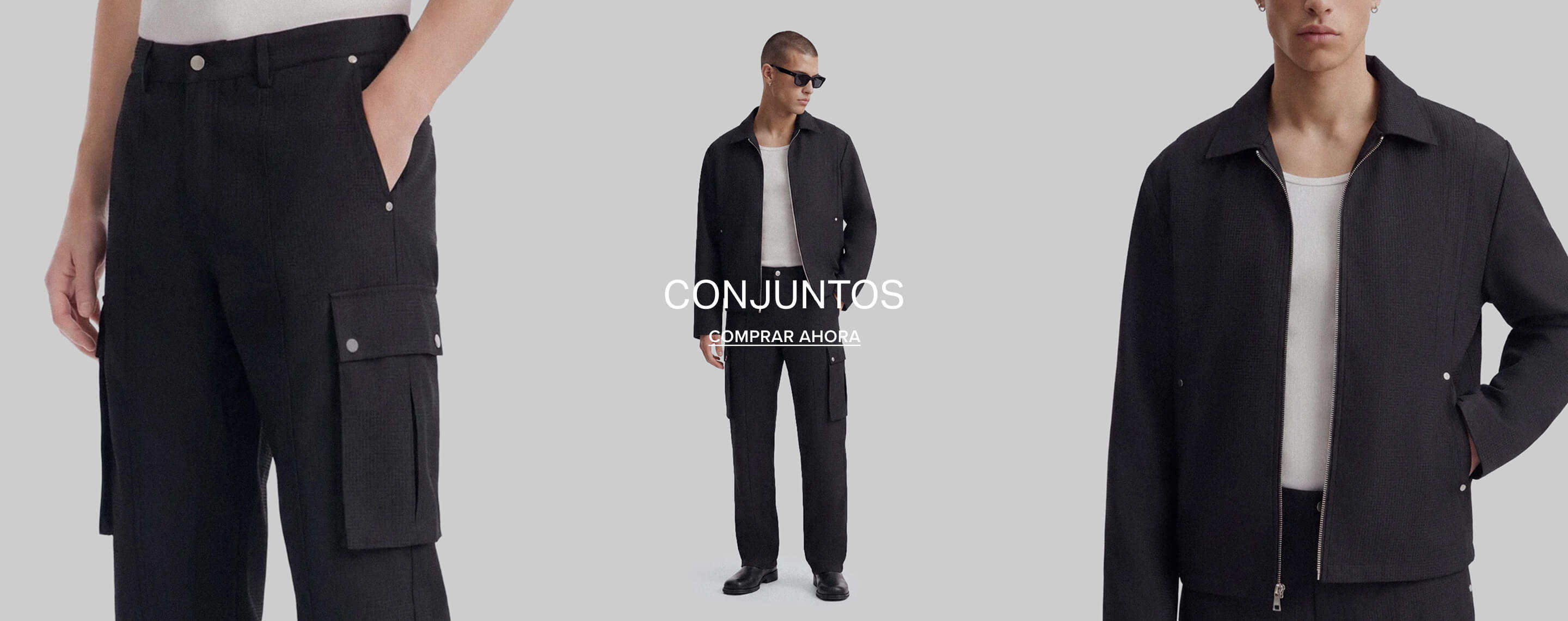 Hombre con chaqueta negra de cremallera y pantalón a juego sobre una camiseta blanca. Texto superpuesto: Matching Sets, Shop Now.