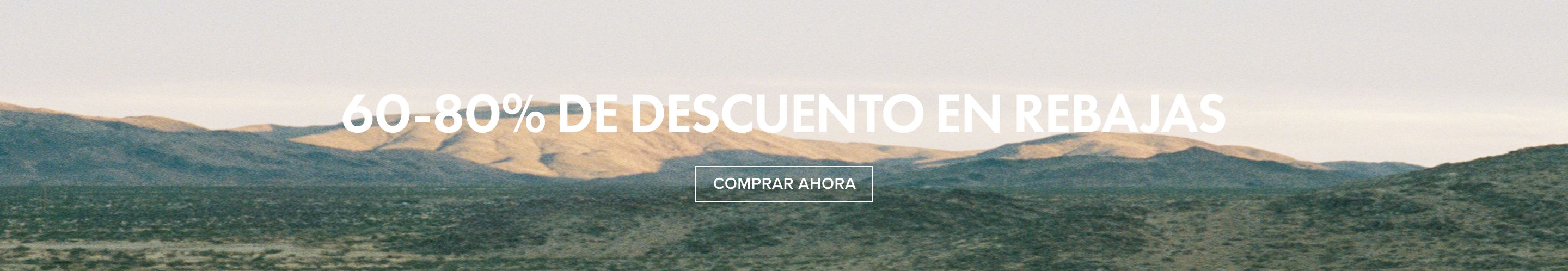 Banner de paisaje montañoso desértico anunciando rebajas con 60-80% de descuento y botón "Comprar Ahora".