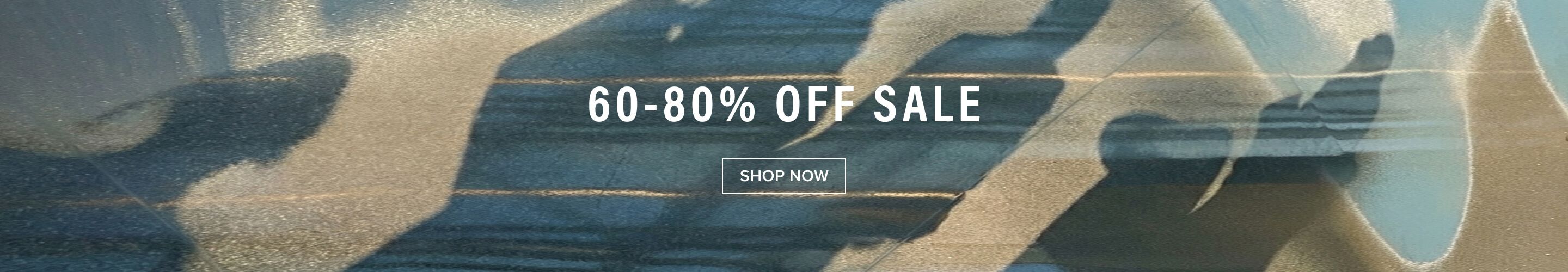 Big white text: '60-80% OFF SALE' on a blurred grey-blue and gold background. Shop now for huge discounts and amazing savings!