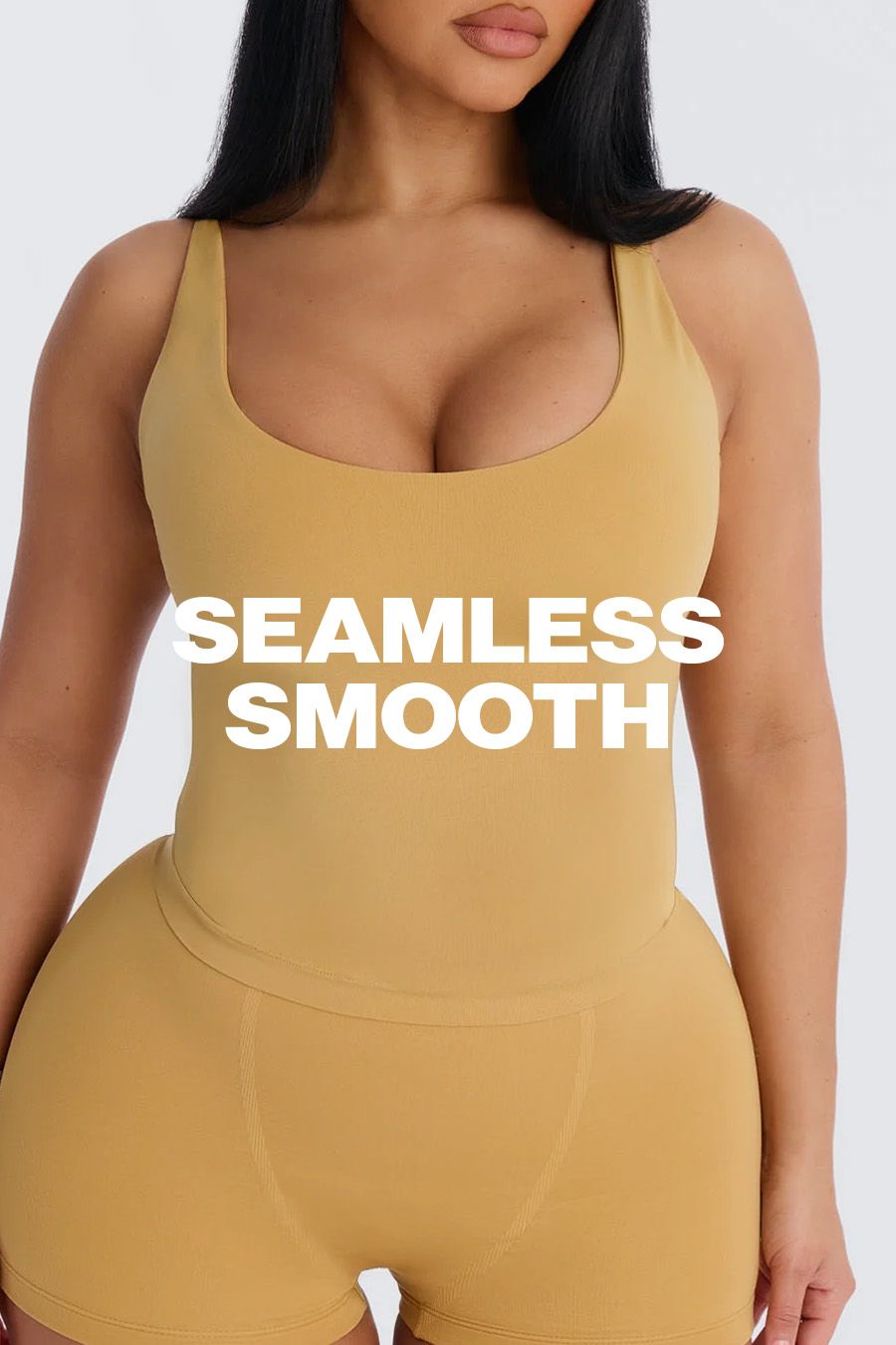 Woman in a gold seamless bodysuit and matching shorts, highlighting a smooth, comfortable fit. Promoting new seamless loungewear.
