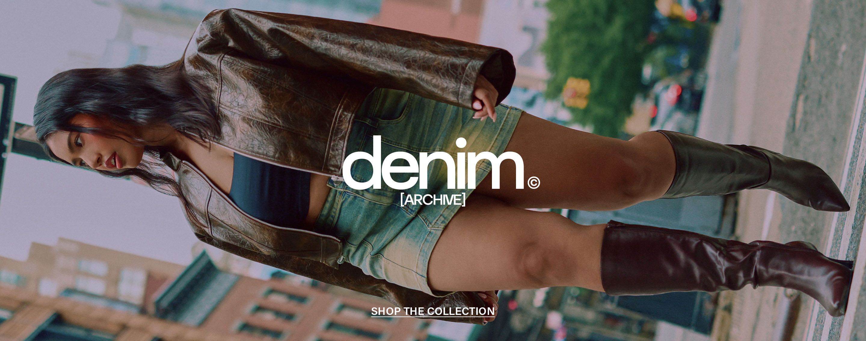 Woman walking outdoors wearing a brown textured jacket and acid-wash denim mini skirt. Shop the trendy denim archive collection now!
