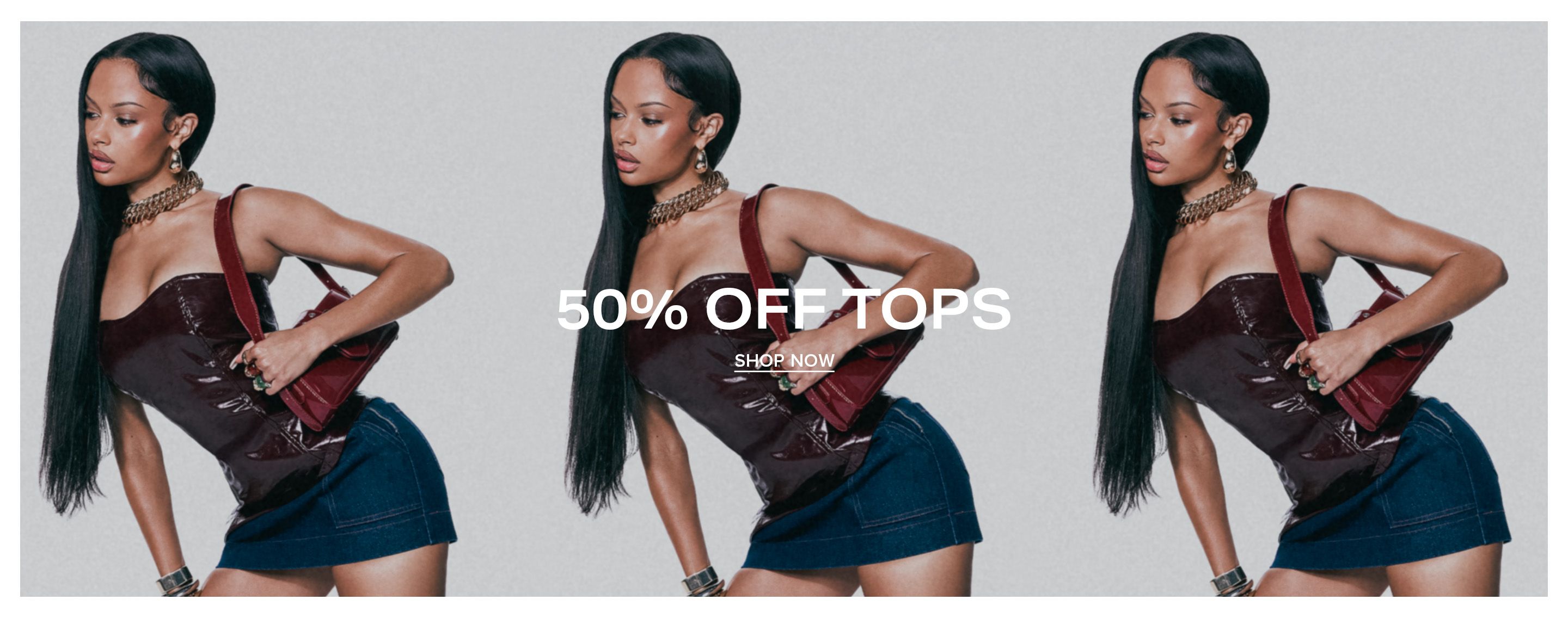 A model wearing a shiny burgundy corset top and denim miniskirt poses for a 50% off tops sale campaign with a matching shoulder bag.