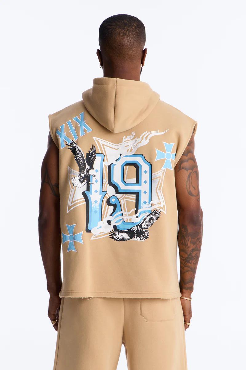 Tan sleeveless hoodie and shorts. Rear view showcasing light blue '19', 'XIX', and black eagles. Promotes men's graphic streetwear.