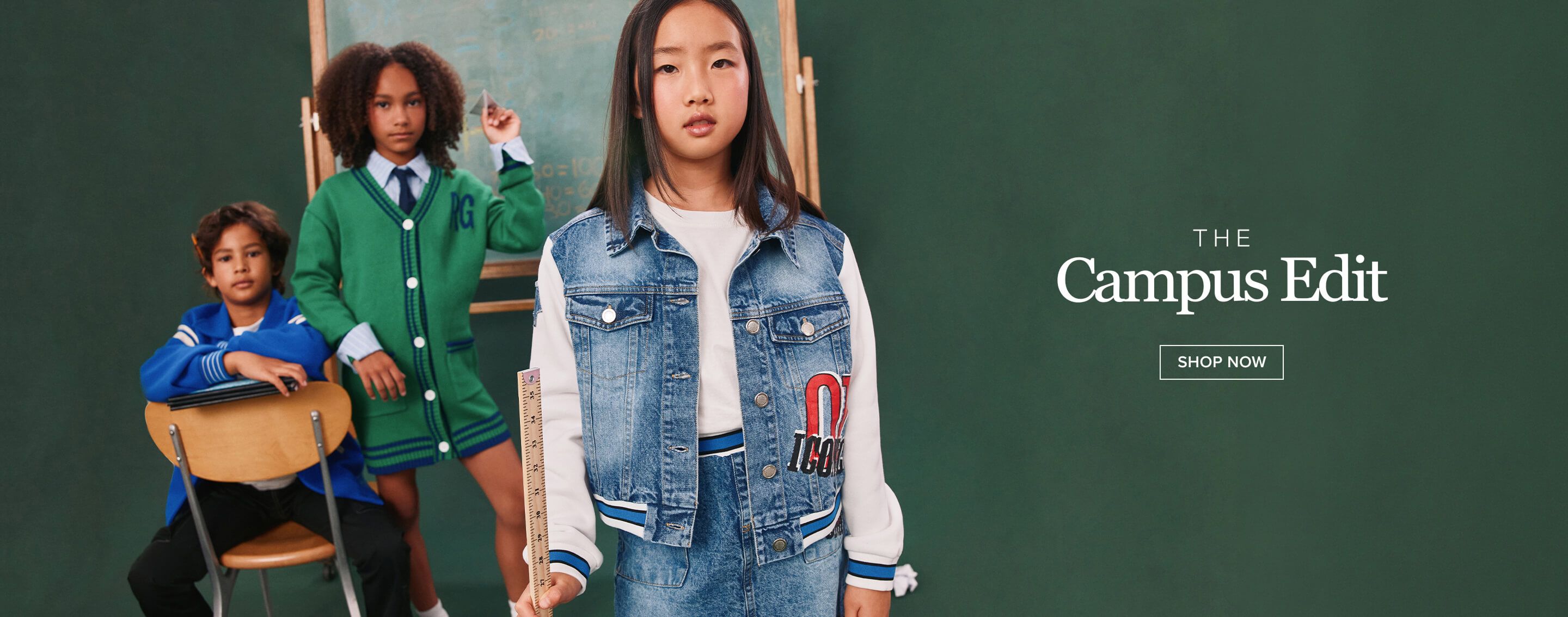 Three kids in stylish campus edit outfits: blue letterman, green cardigan, denim jacket. Shop new back-to-school fashion now!