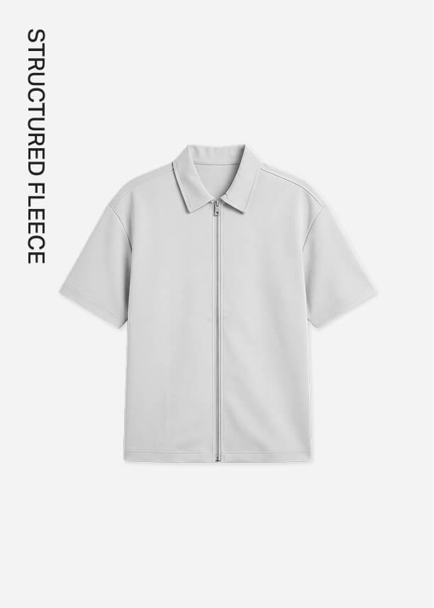 Light gray structured fleece short sleeve zip-up shirt with a collar, promoting the brand's new minimalist men's streetwear collection.