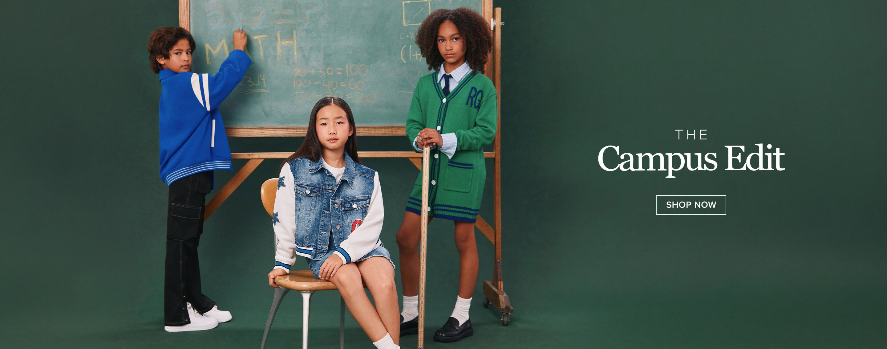 Three kids showcase The Campus Edit. Blue jacket boy writes; denim girl sits; green cardigan child stands. Shop now!