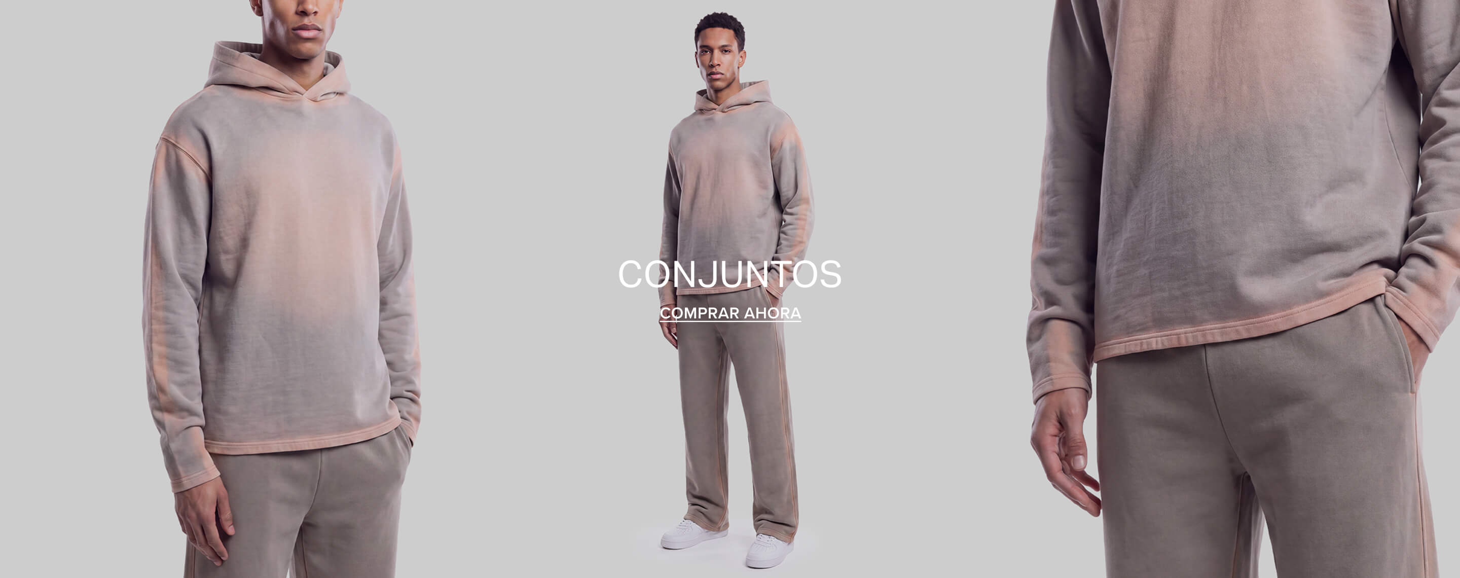 Hombre con conjunto de sudadera rosa pastel y gris lavado. Texto superpuesto: Matching Sets, Shop Now. Promueve ropa urbana de hombre.