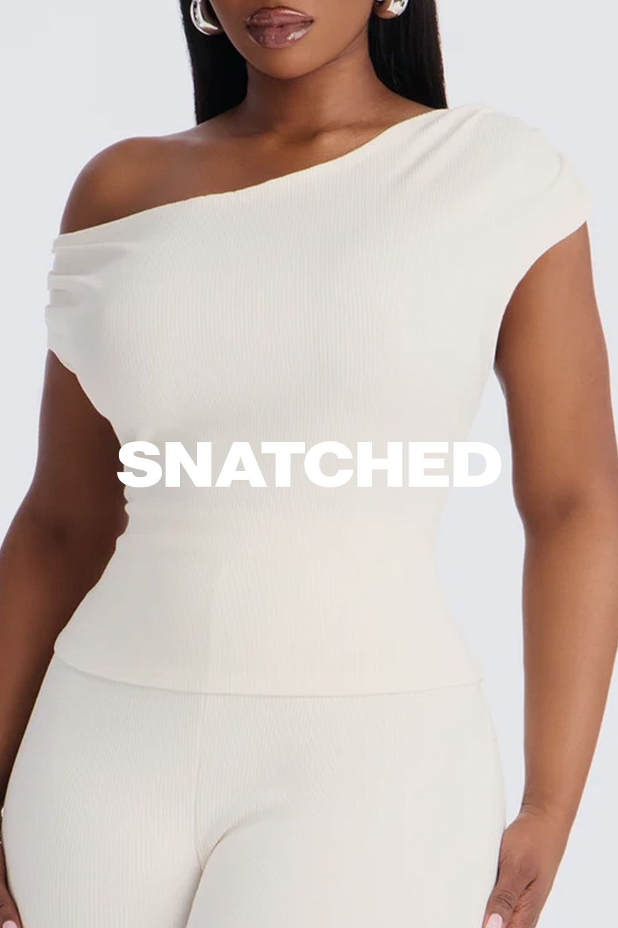 Woman in a cream ribbed one-shoulder top and pants, promoting a contouring shapewear collection with the bold overlay text SNATCHED.