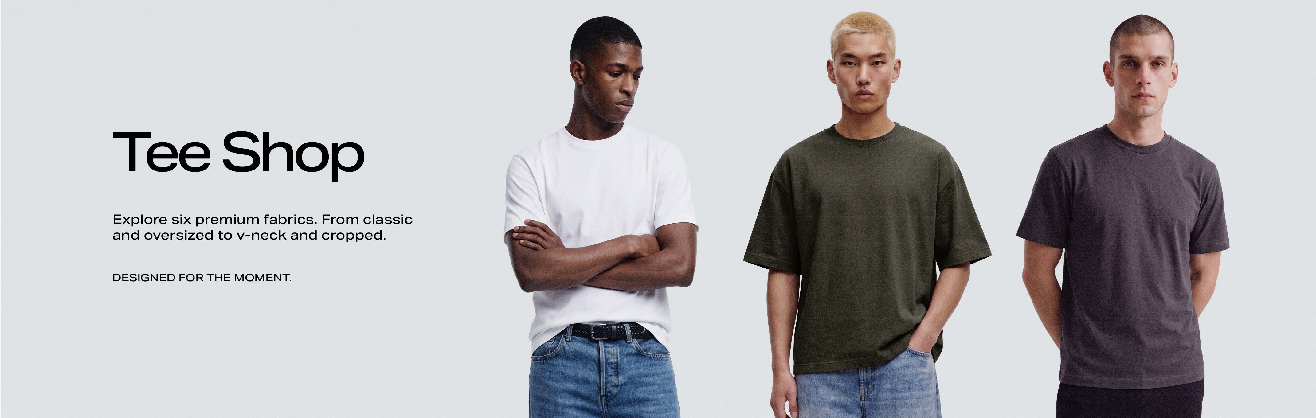 Three men modeling premium t-shirts in classic white, oversized olive green, and charcoal gray crew neck styles for the Tee Shop collection.