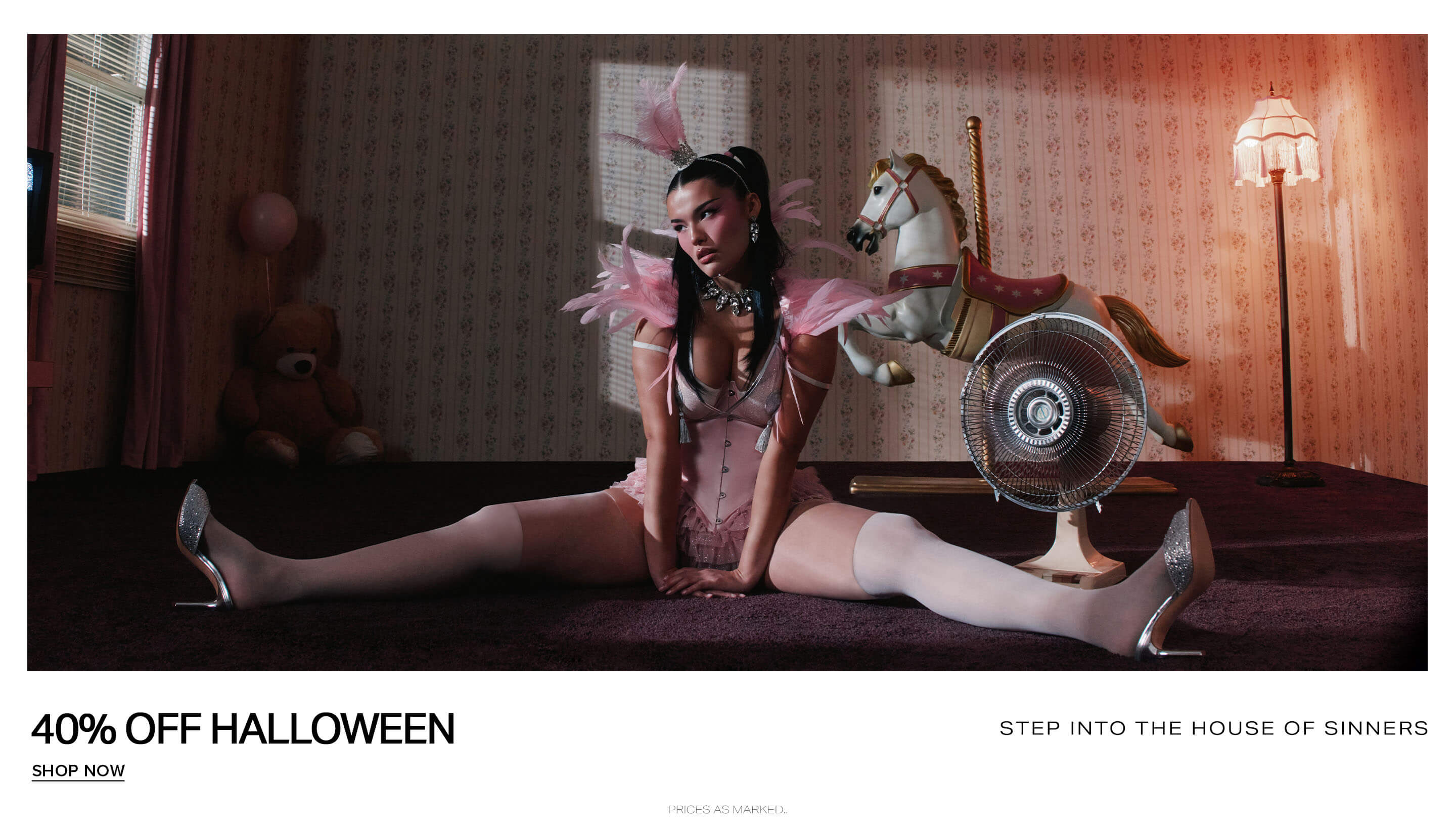 Sexy pink Halloween lingerie worn by a woman posing on a white carousel horse, promoting the House of Sinners 40% off sale event.