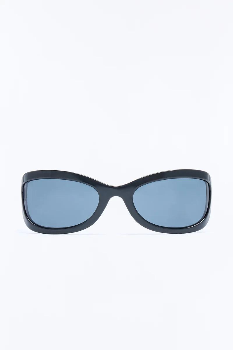 Black oval sunglasses with thick frames and blue tinted lenses.