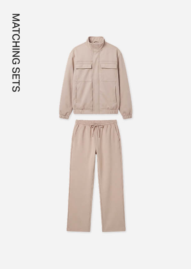 Beige matching set with a zip-up jacket featuring chest pockets and drawstring pants.