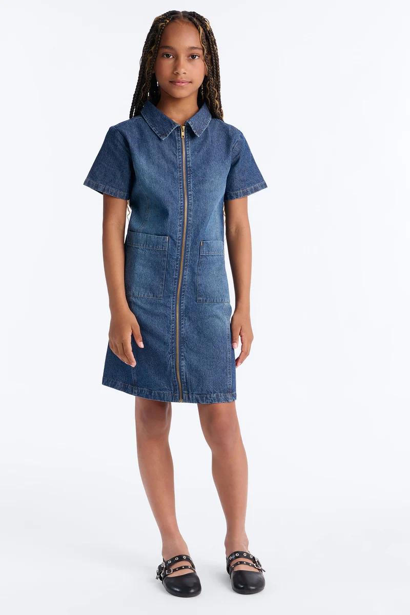 Girls blue denim zip-front dress with short sleeves and pockets.