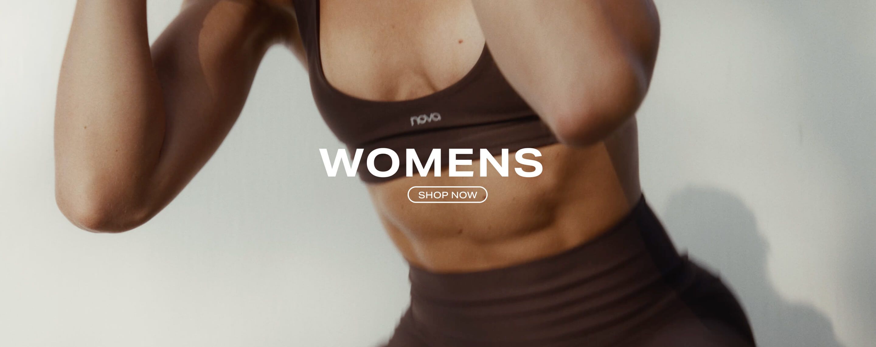 Athletic woman in brown Nova sports bra and leggings with 'WOMENS SHOP NOW' overlay to promote shopping the women's activewear collection.