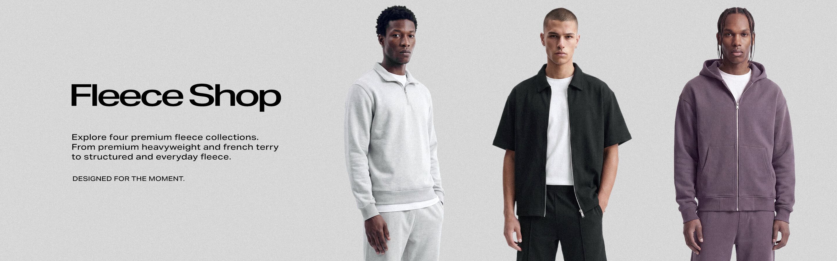 Three men modeling premium t-shirts in classic white, oversized olive green, and charcoal gray crew neck styles for the Tee Shop collection.