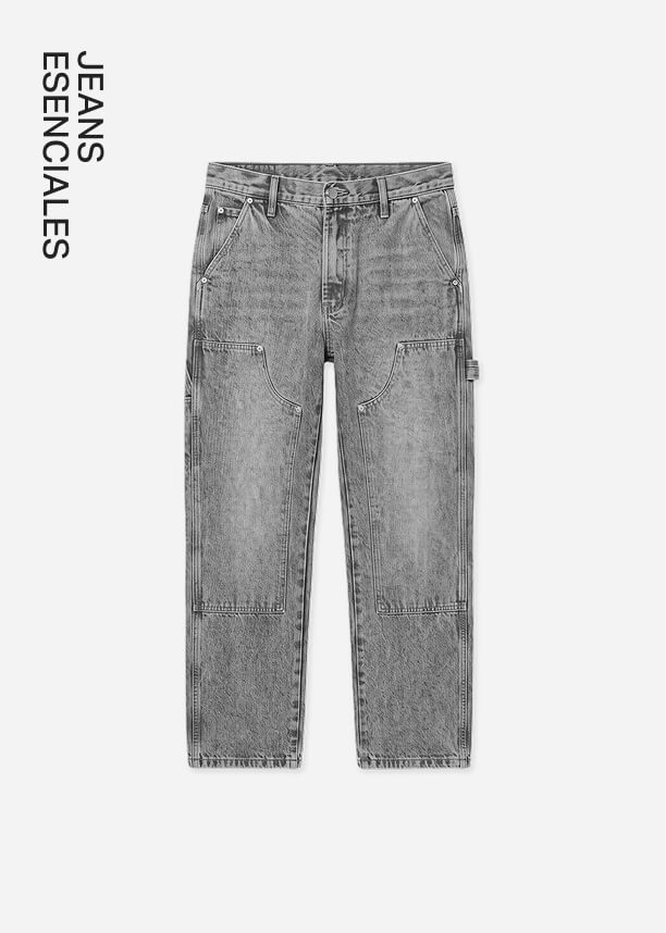 Vaqueros estilo carpenter en lavado gris con bolsillos utilitarios de la colección Denim Essentials, presentados en fondo blanco.