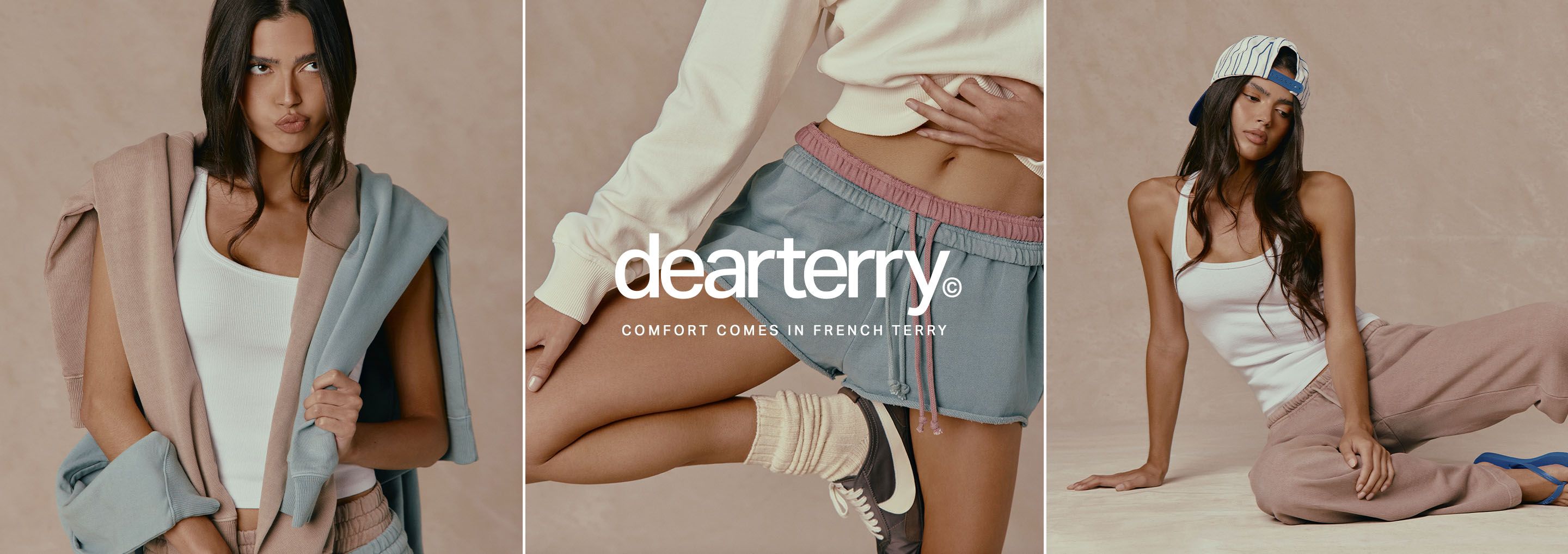 Model in blue dearterry French terry shorts with pink waistband and cream top, promoting cozy, comfortable women’s loungewear.