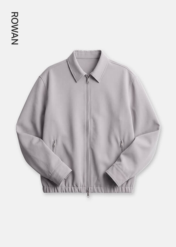 Light grey Rowan zip-up jacket with classic collar and zippered pockets presented on a plain background for the outerwear collection.
