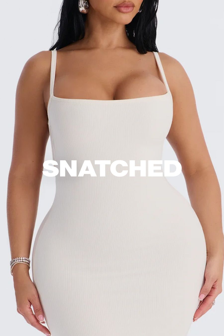 Cream ribbed bodycon dress on a model with hourglass curves, featuring the text "Snatched" to promote the shaping dress collection.