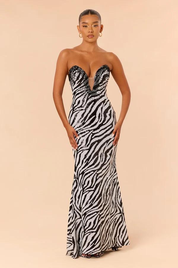 Strapless black and white zebra print evening gown with a plunging sweetheart bust, showcasing a new formal holiday prom dress collection.