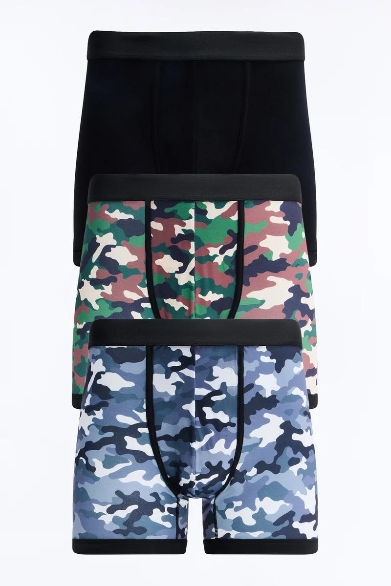 Stacked men's boxer briefs: black, green camo, and blue camo patterns, showcasing comfortable underwear.