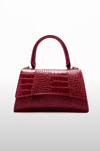 Stylish burgundy crocodile-embossed top-handle handbag. Elevate your look with this luxurious fashion accessory. Shop our new collection.