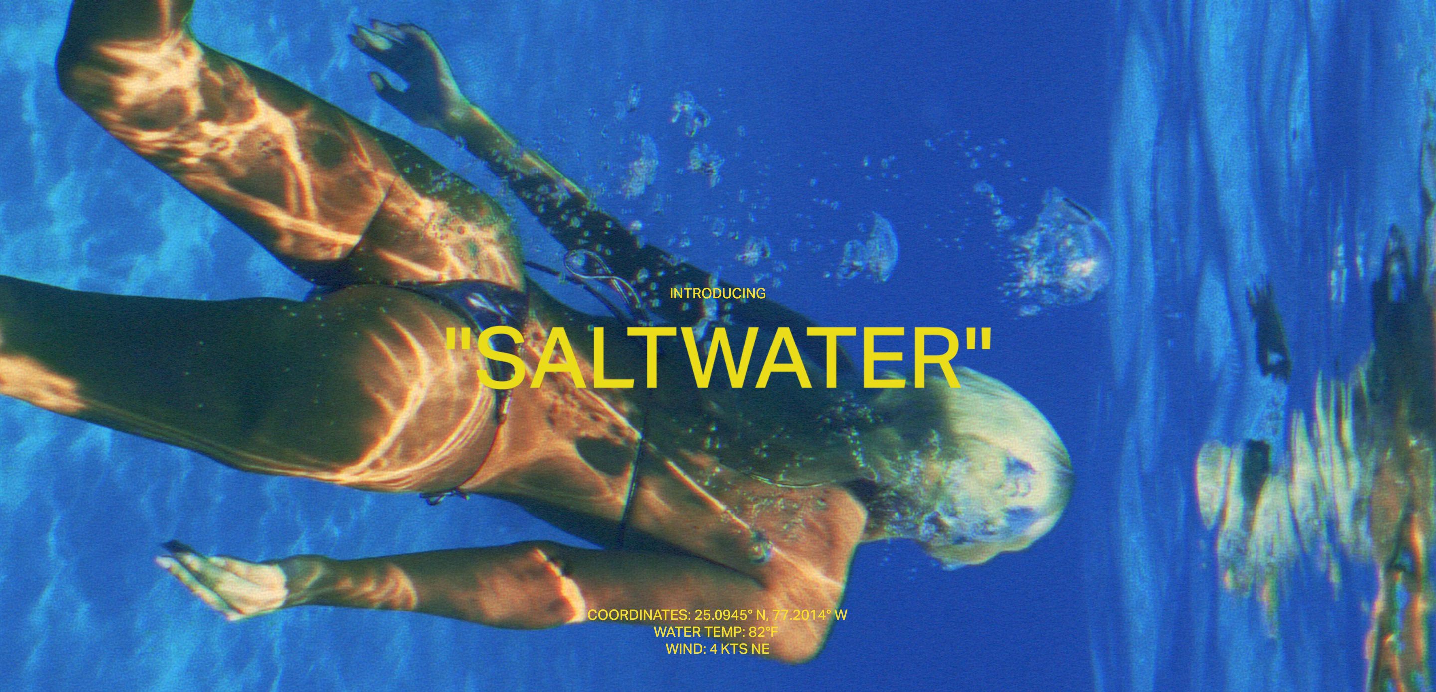 Blonde woman in dark bikini swimming underwater, sunlight patterns on skin, launching the new Saltwater swimwear collection.
